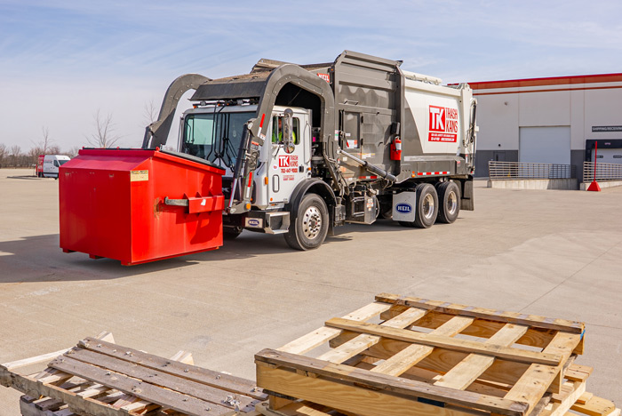 commercial garbage truck at warehouse